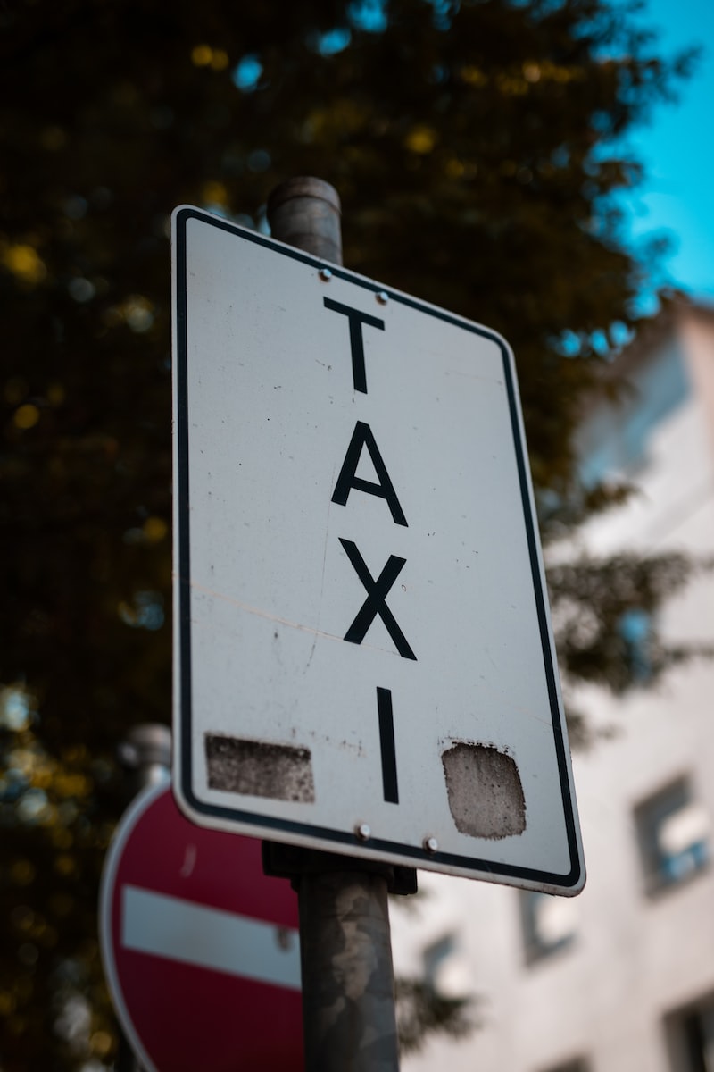 white and black pedestrian sign